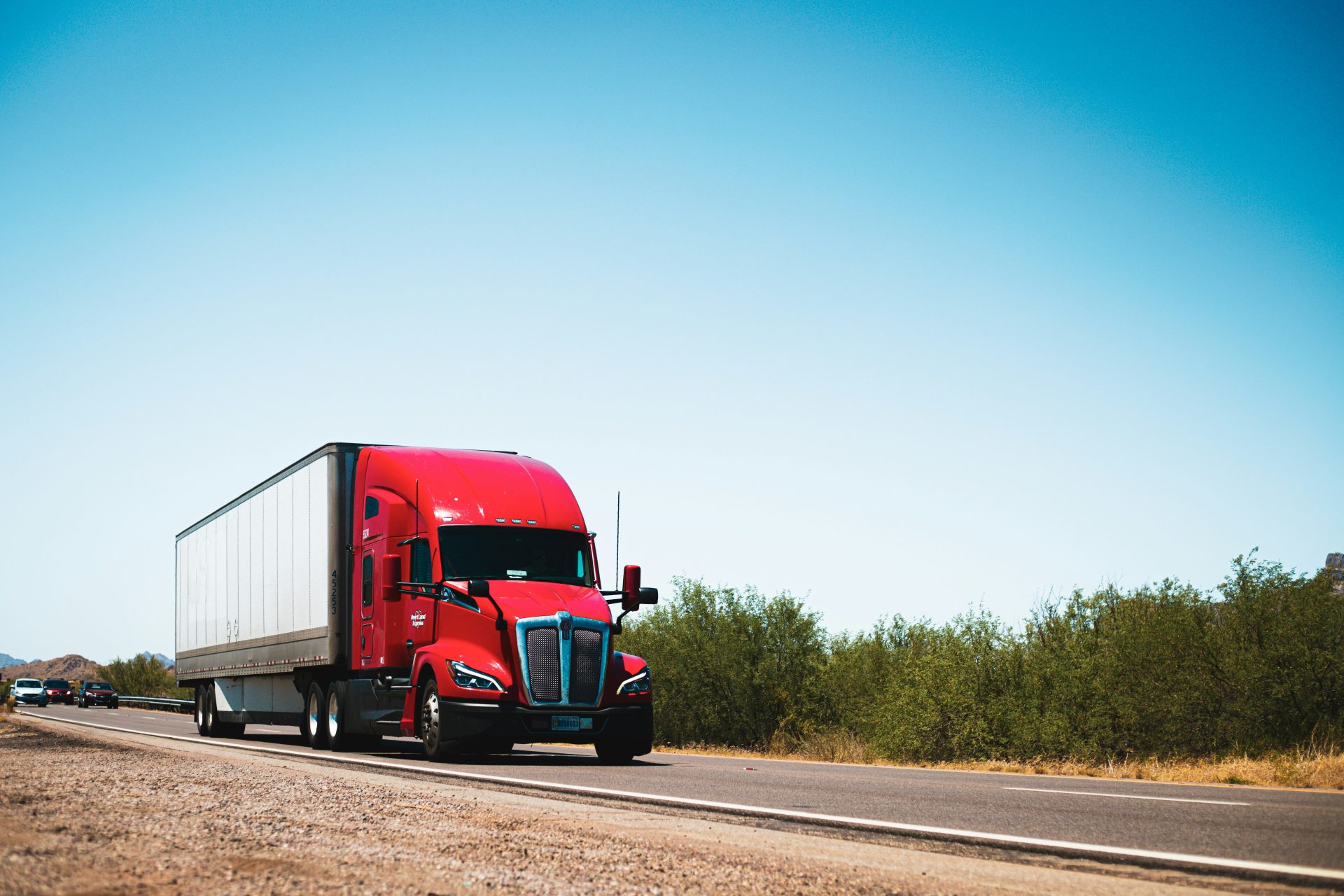 Red semi-truck on highway